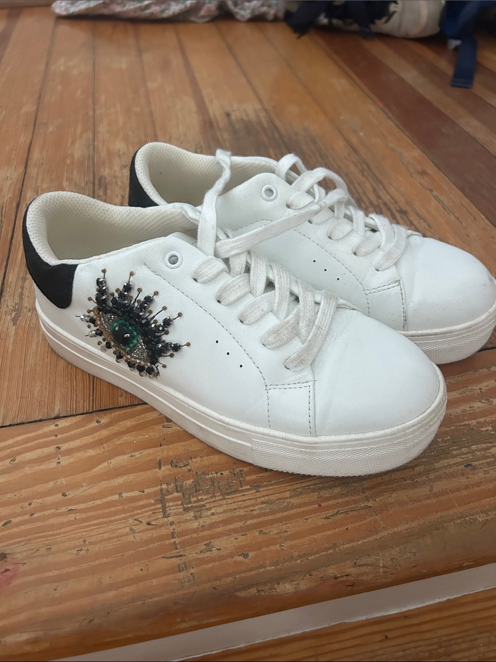 Kurt Geiger White Platform Sneakers with Green Jeweled Eye Detail
